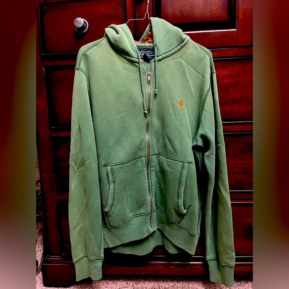 Green zip-up Polo hoodie. Has an Aztec-type design in the hood liner. Medium.